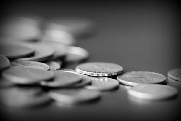 istock American cents on a dark background close up. Black amd white 1145377682
