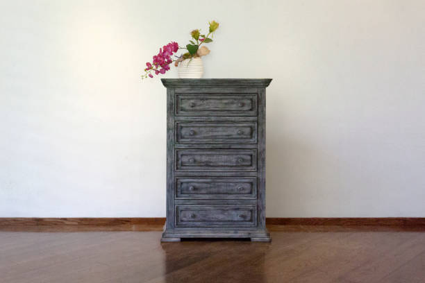 istock Black drawer with Flowerpots white background and decoration 1145380413