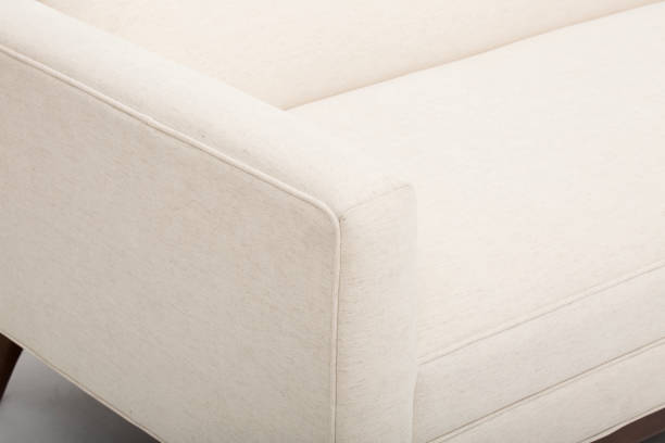 istock Comfortable Cream colour studded back luxury sofa with white background 1145380653