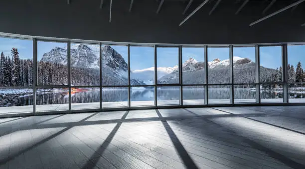 Photo of window view of rocky mountains and lake