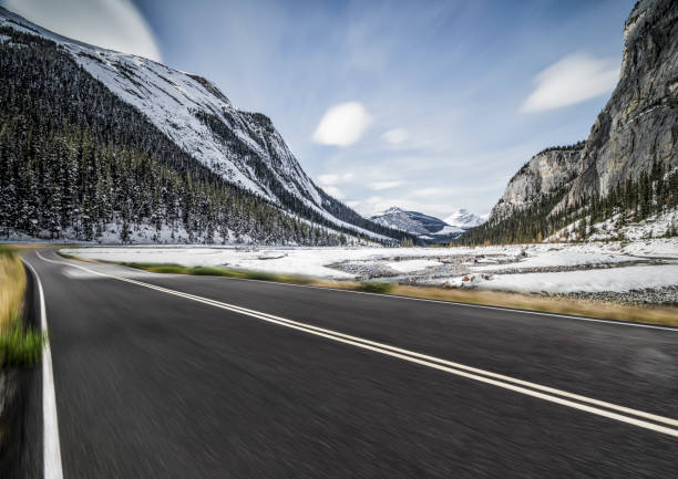 istock road towards rocky mountains 1145382730