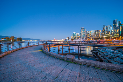 A fine art landscape photography image of the downtown Vancouver skyline from a done during a fiery and dynamic Spring sunrise.