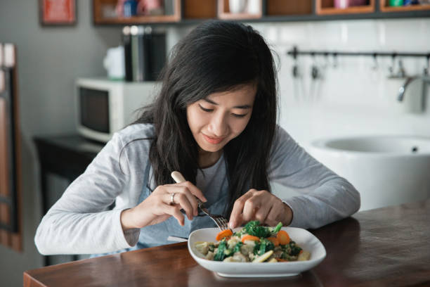 istock asian woman preparing food 1145384897