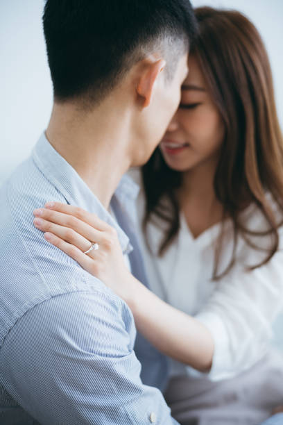 istock Newly engaged couple embracing and kissing 1145384990