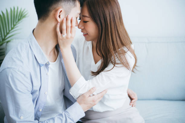 istock Newly engaged couple embracing and kissing 1145385019