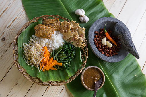 nasi pecel. vegetable with peanut sauce. indonesian tradtional food