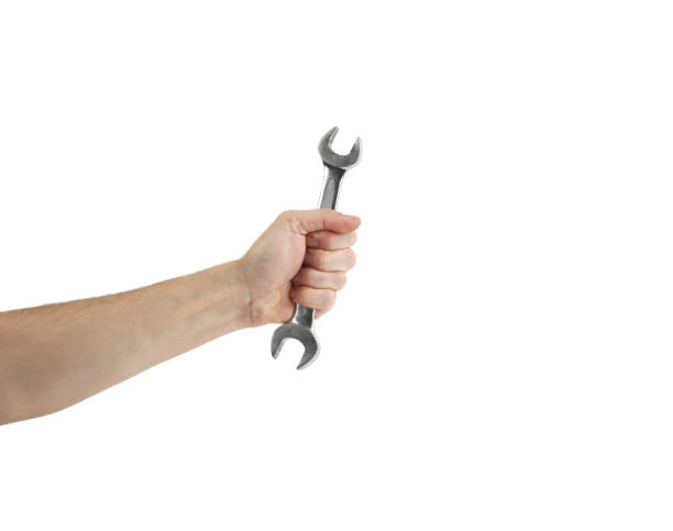 istock Male Hand Holding Adjustable  Wrench 1145388837