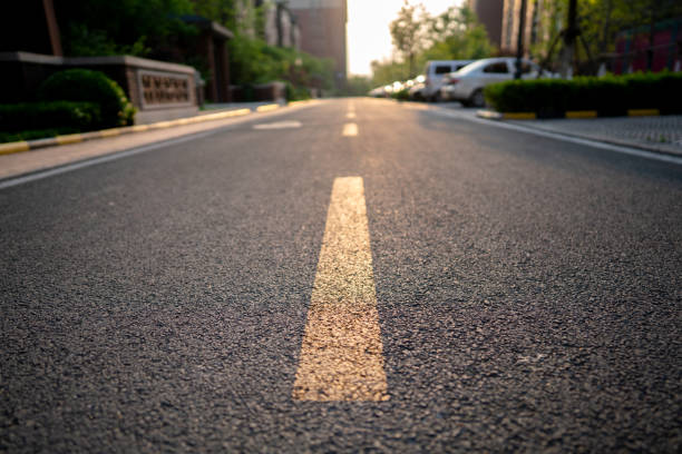 istock road in residential district at sunset 1145389788