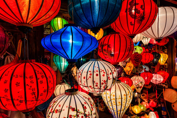 Traditional silk hanging lanterns in Hoi An city, Vietnam Asian ( Chinese / Vietnamese ) traditional silk hanging lanterns lanterns, night market in Hoi An. Hoi An is situated on the east coast of Vietnam. Its old town is a UNESCO World Heritage Site because of its historical buildings. chinese lantern lily photos stock pictures, royalty-free photos & images