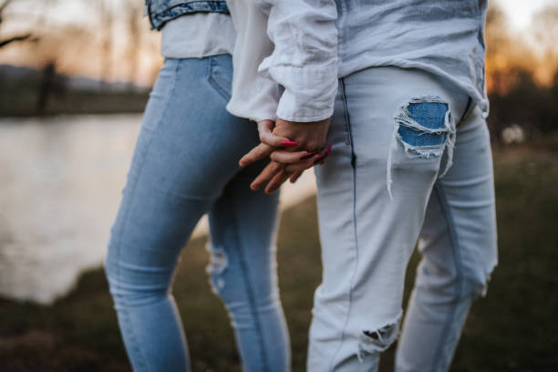 istock Happy couple enjoying sunset by the river 1145392571