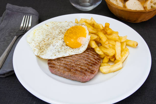 istock chopped steak, egg and fries 1145392605