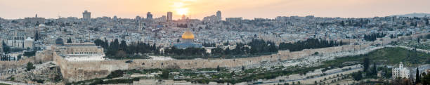 Jerusalem Cityscape Sunset Temple Mount Panorama Israel Iconic Jerusalem Old Town Cityscape Panorama of Temple Mount at Sunset. Holy Land view from above towards the famous  Al-Aqsa Mosque - Golden Dome of the Rock- the Western Wall, Bell Tower of the Church of the Redeemer,  Church of the Holy Sepulchre and surrounding Old Town City Wall. Stiched Multiframe XXXXL Panorama. Jerusalem Old Town, Israel. kidron valley stock pictures, royalty-free photos & images
