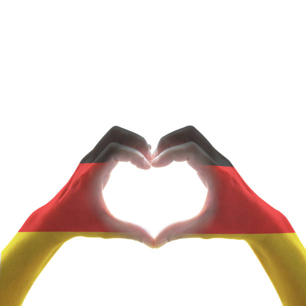 istock Germany national flag on people heart shape hands. 1145395620