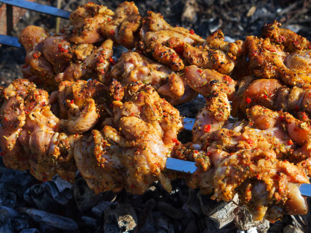 istock Chicken kebabs cooking on a BBQ. Close-up, selective focus. 1145397098