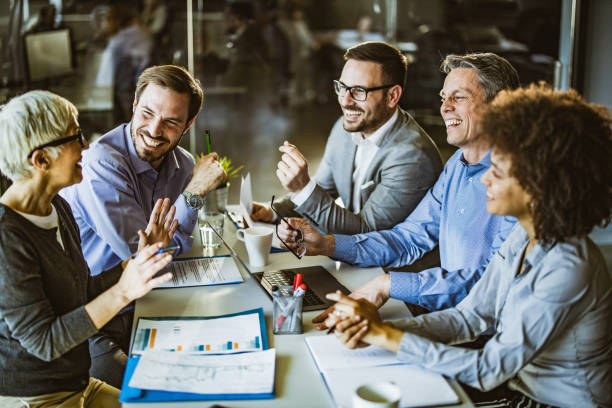 istock Happy business team making plans on a meeting in the office. 1145397789