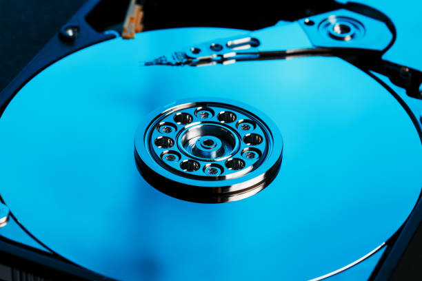 istock Disassembled hard drive from the computer, hdd with mirror effect Opened hard drive from the computer hdd with mirror effects Part of computer pc 1145402677