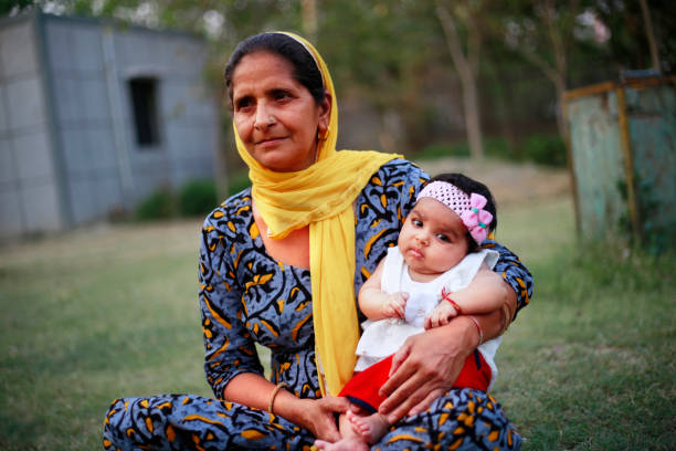 istock Grandmother holding grandchild 1145402748