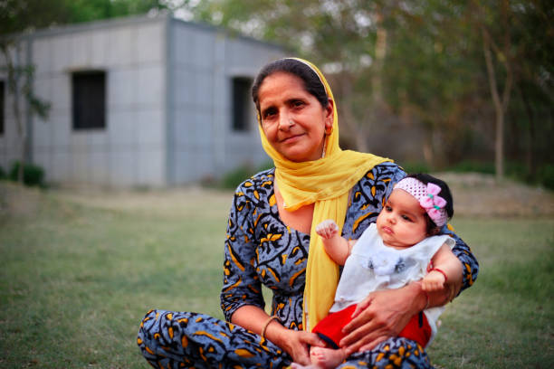 istock Grandmother holding grandchild 1145402751