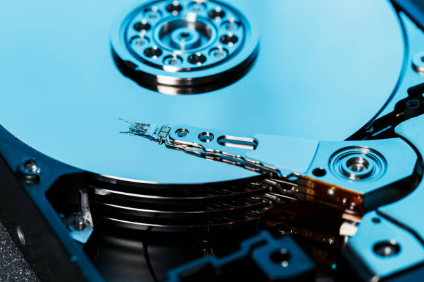 istock Disassembled hard drive from the computer, hdd with mirror effect. Opened hard drive from the computer hdd with mirror effects. Part of computer pc, laptop 1145402765