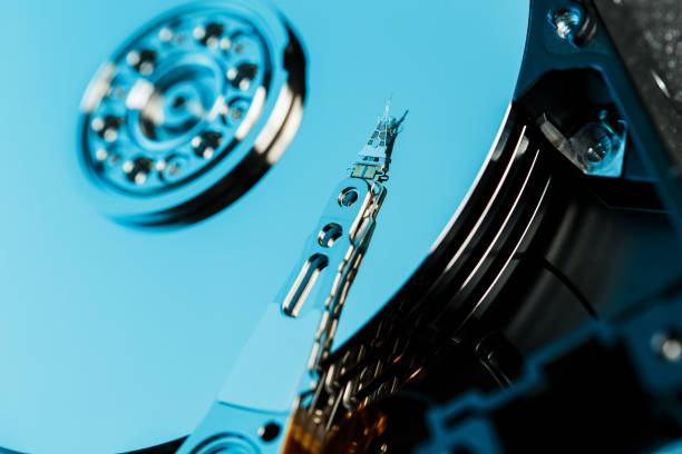 istock Disassembled hard drive from the computer, hdd with mirror effect. Opened hard drive from the computer hdd with mirror effects. Part of computer pc, laptop 1145403013