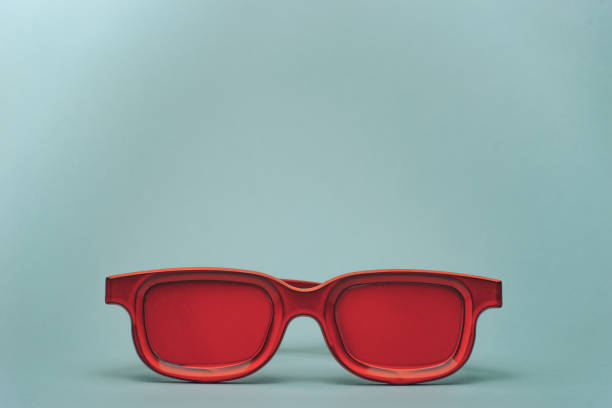istock Red glasses on a gray table background. Summer concept. 1145409103