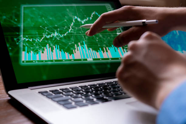 istock young businessman broker watching on the stocks on his devices 1145410113