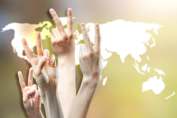 istock group of people show peace sign concept b 1145410144