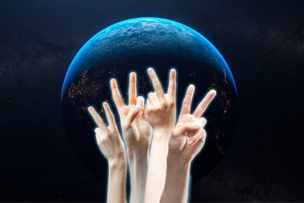 istock group of people show peace sign concept b 1145410166