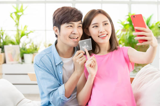 istock pregnant woman selfie with husband 1145413357