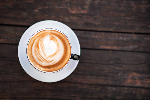 istock A cup of coffee on a dark wooden table. Copy space. 1145413697