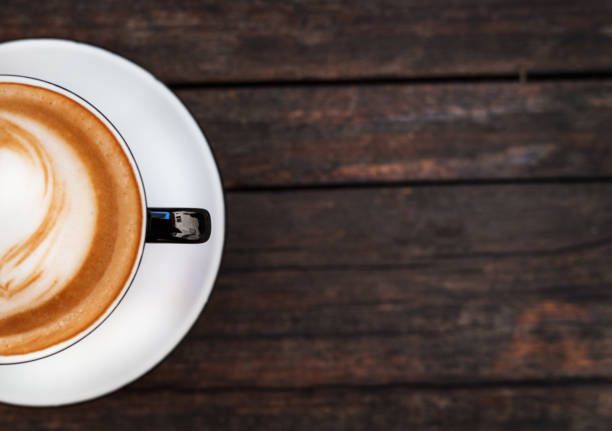 istock A cup of coffee on a dark wooden table. Copy space. 1145413715