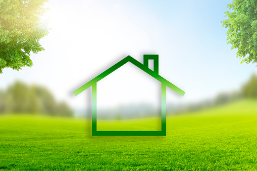 Home Symbol in Landscape with green Meadow