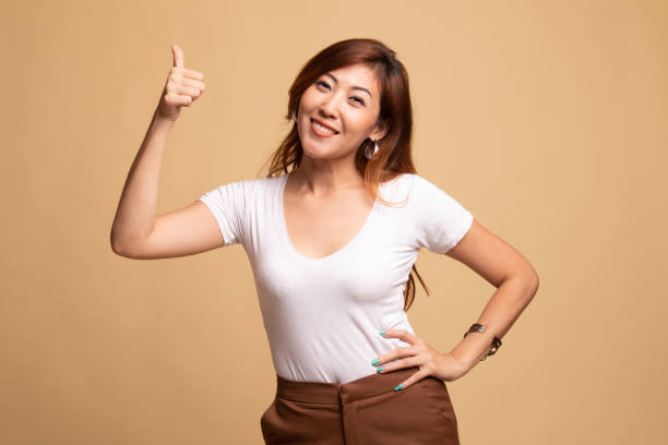 istock Young Asian woman show thumbs up. 1145420687