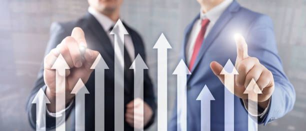 istock Up arrow graph on skyscraper background. Invesment and financial growth concept. 1145423292