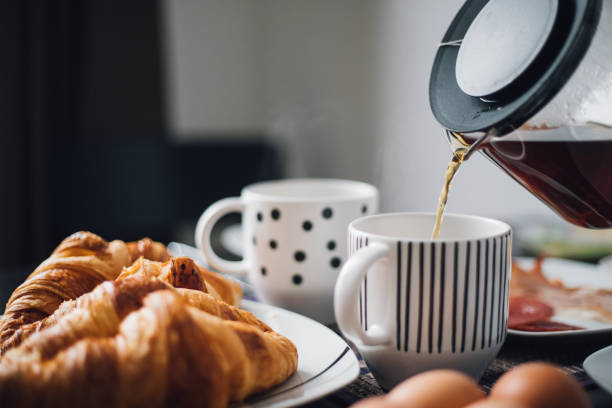 istock Breakfast with cup of coffee and croissants 1145425195
