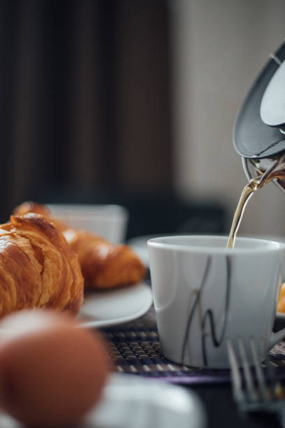 istock Breakfast with cup of coffee and croissants 1145426219