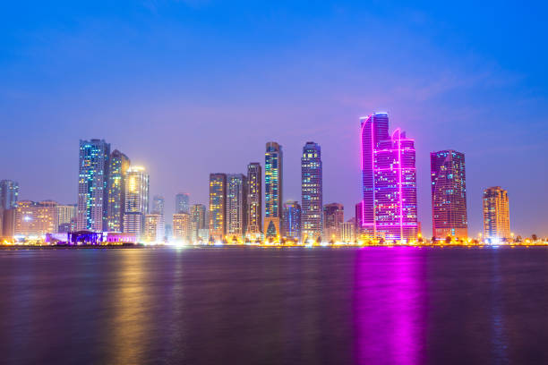 Capturing the essence of urban expansion, this photo showcases a city's skyline with prominent high-rises at the subtle onset of evening