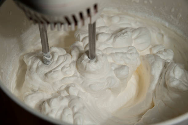 istock Electric food mixer mixing cake icing. 1145427440