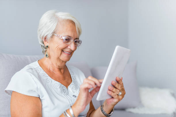 istock Senior woman reading a message 1145427451