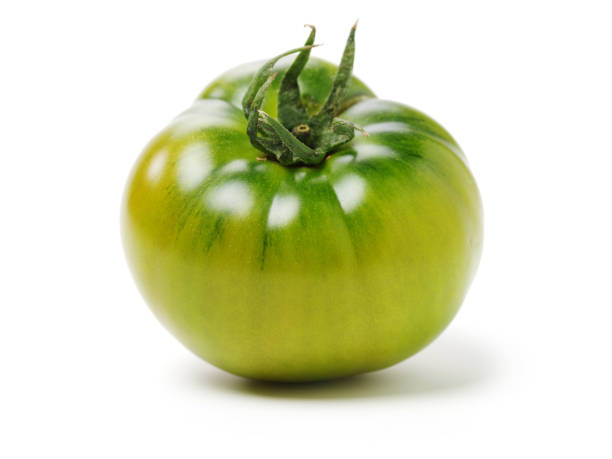 istock fresh green tomato isolated on white background 1145427488
