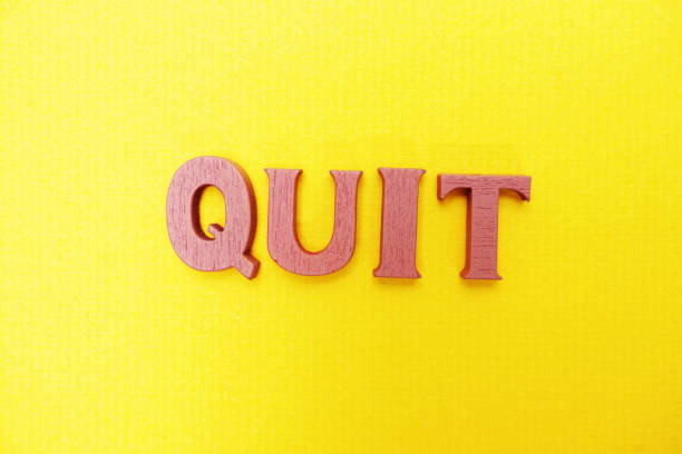 istock Top view Quit letters alphabet letters on Yellow background 1145429874