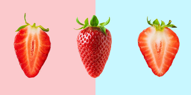 istock Different strawberries on bright background. Minimal food concept. 1145432401