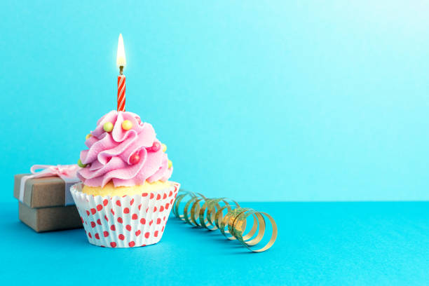 istock Colorful celebration background with various party decoration and cupcake. Minimal party concept. 1145432418