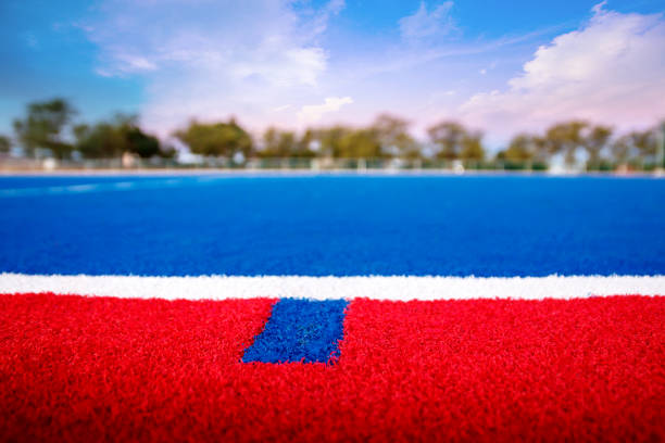 Modern astroturf hockey field in blue and red