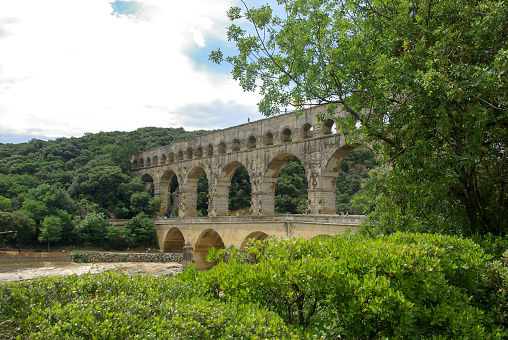 Roman aqueduct Pont du Gard, Unesco World Heritage site. Located near Nimes, Languedoc, France , antique light saturation
