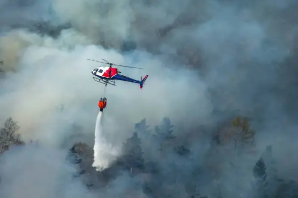 Helicopter extinguishing wildfire. Bergen, Norway.