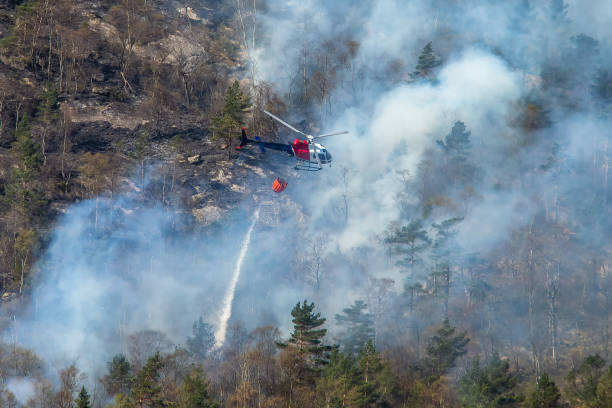istock Helicopter extinguishing wildfire. Bergen, Norway. 1145434810