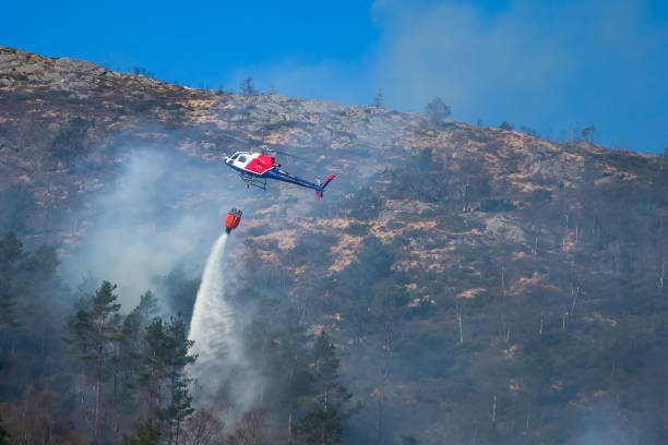 istock Helicopter extinguishing wildfire. Bergen, Norway. 1145436199