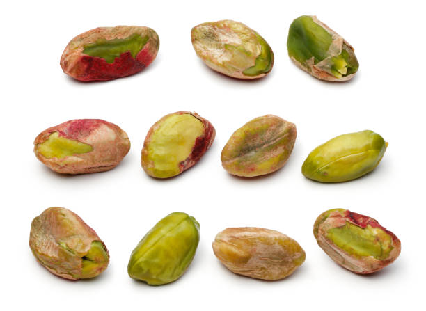 istock Peeled pistachio nuts isolated on white 1145436334