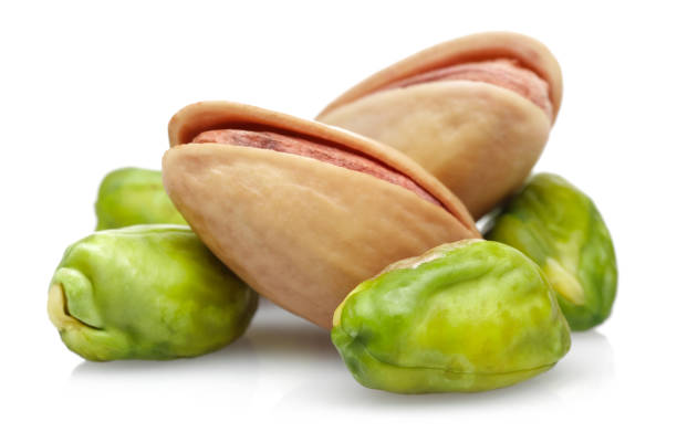 istock Group of pistachio nuts isolated on white 1145437522